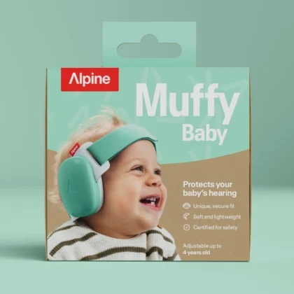 Baby wearing green Alpine Muffy Baby hearing protection earmuffs